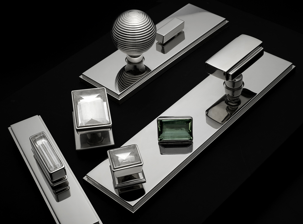 Ensemble of modern hardware in polished nickel and custom rock crystal pulls.