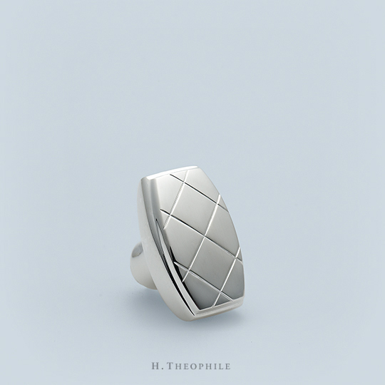 Thumb turn with hand-chased crosshatch