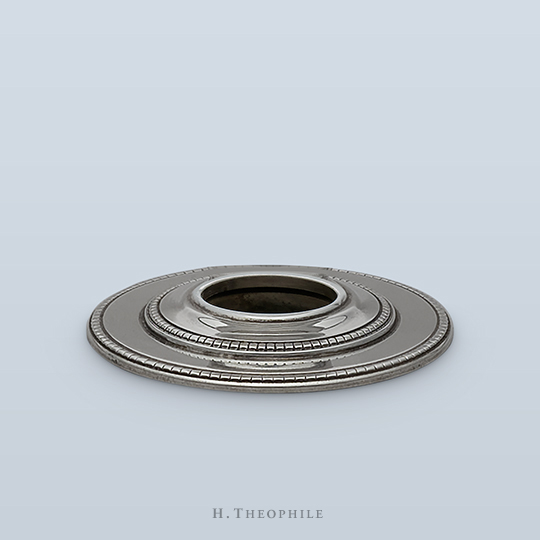 Rosette with stepped design and two rows of beading with incised lines