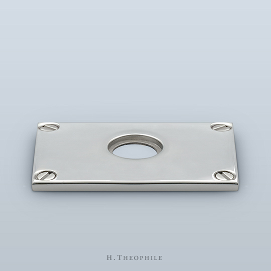 Rectangular backplate with visible screws