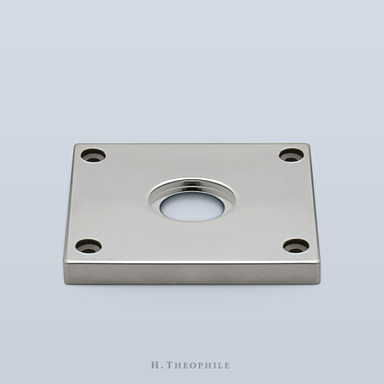 Square tile backplate with visible screws