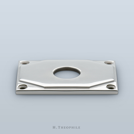 Rectangular backplate with octagonal step, visible screws