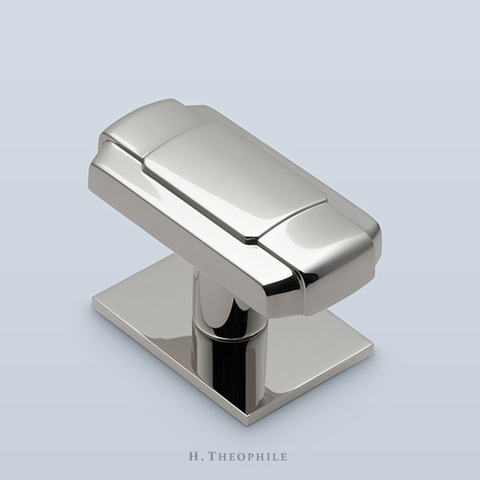 Rectangular knob with buckle motif
