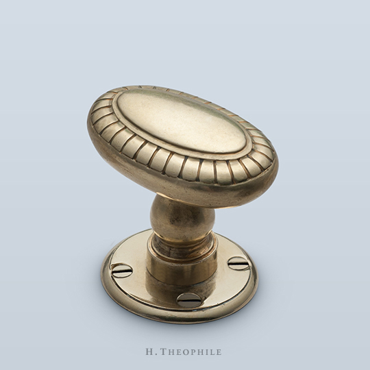 Oval knob with petals at perimeter