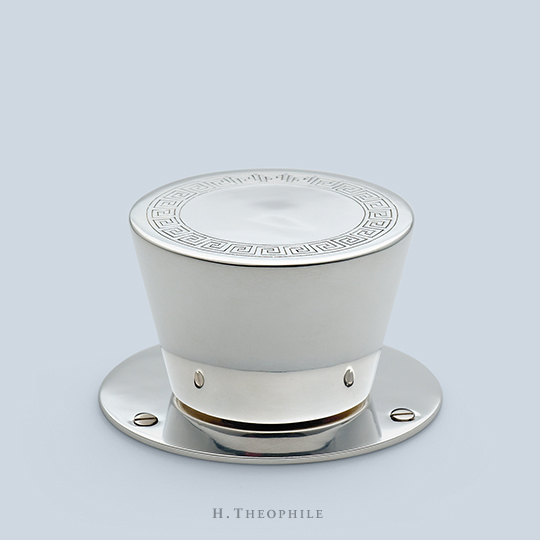 Flare knob with Greek key motif