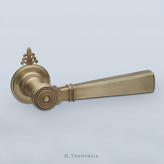 Neoclassical lever with knurled inset band and filigreed cap