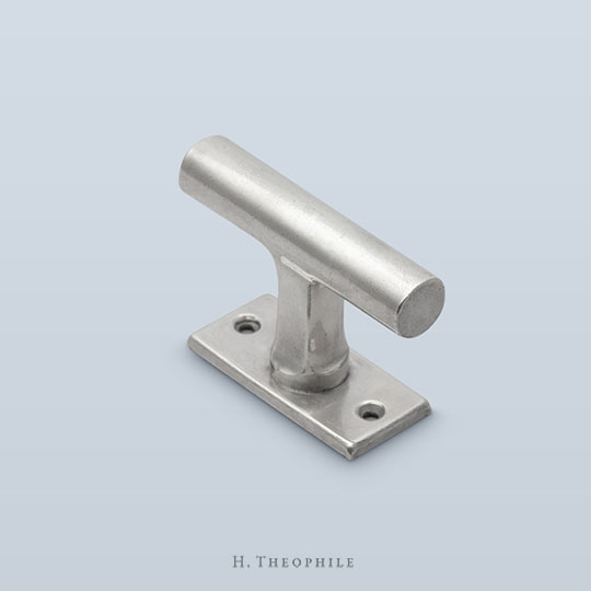 T-shaped casement fastener/internal mechanism with visible screws