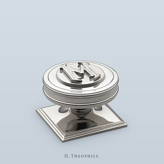 Barrel knob cabinet pull with raised monogram