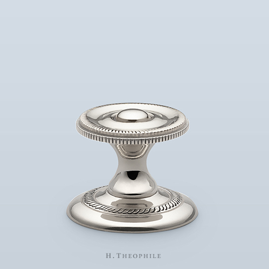 Cabinet pull with raised center and side knurling, 1-3/16" D