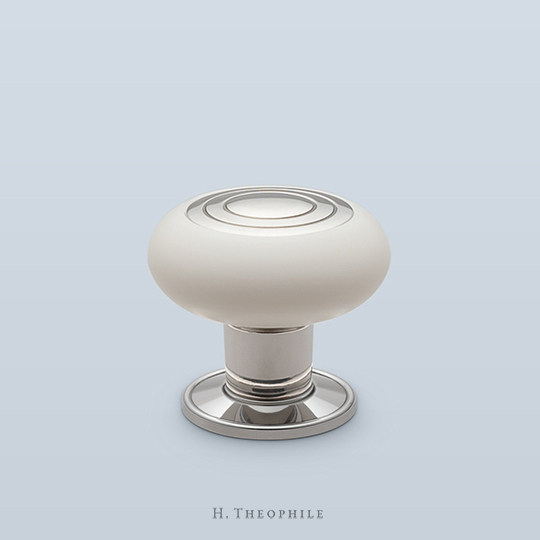 Corian cabinet pull with metal concentric circle center