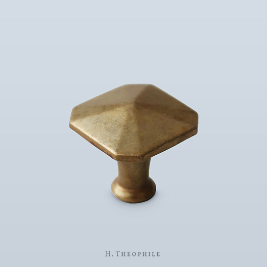 Square pull with faceted face and clipped corners