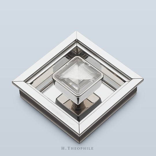 Square rock crystal pull with small chamfers on its corners, with shaft