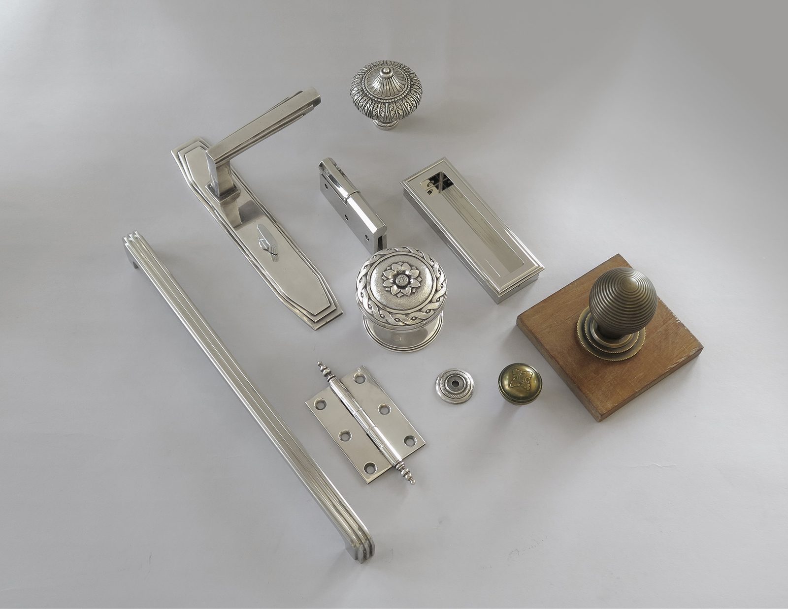 Collection of door and cabinet hardware by H. Theophile with art deco motifs