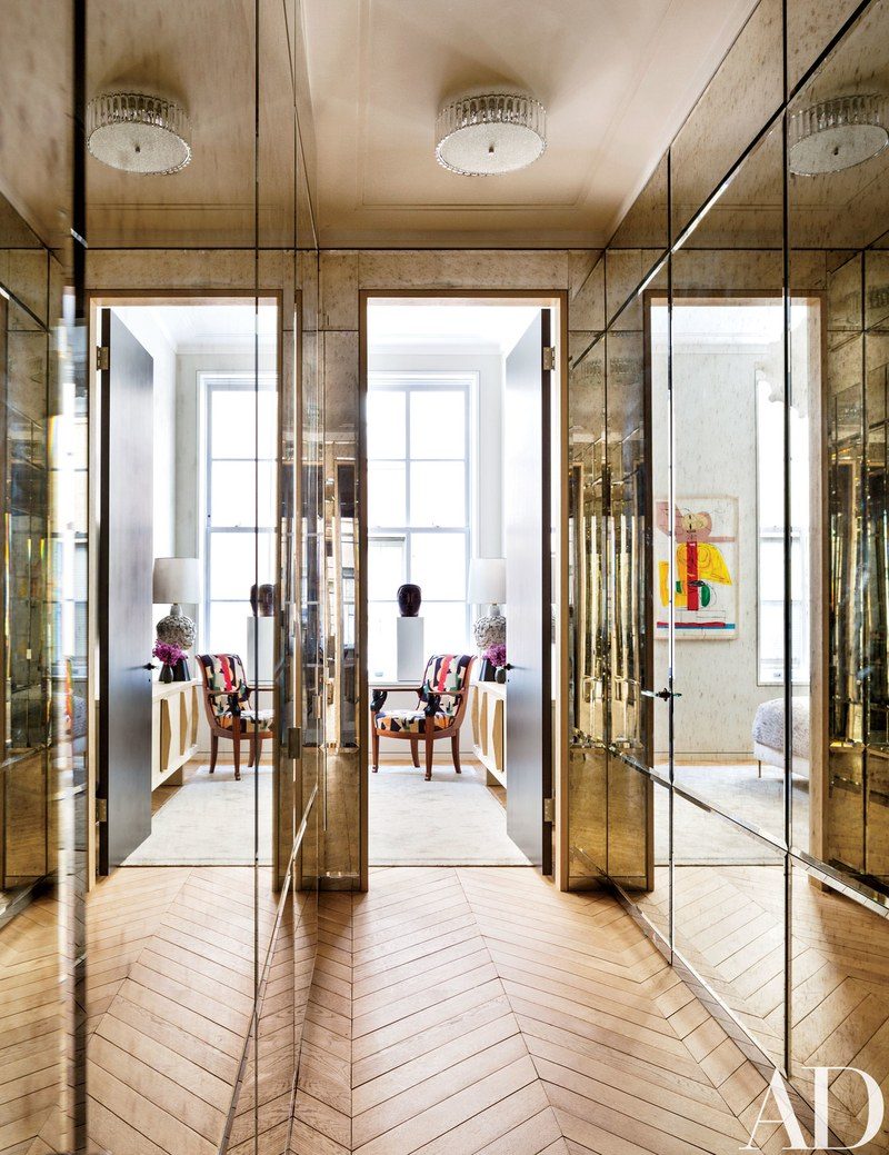 A mirrored closet designed by Steven Harris and Lucien Rees Roberts for their NYC Loft Apartment featuring hardware by H. Theophile.