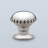 Antique flattened round knob with large beaded perimeter