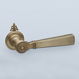 Neoclassical lever with knurled inset band and filigreed cap