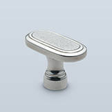 Pill-shaped knob with textured center face