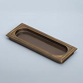 Recessed pull with stepped edge and racetrack window, knurling on frame and window